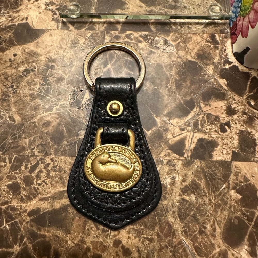 NWOT! Dooney and Bourke Leather Black & Gold keychain Pretty!